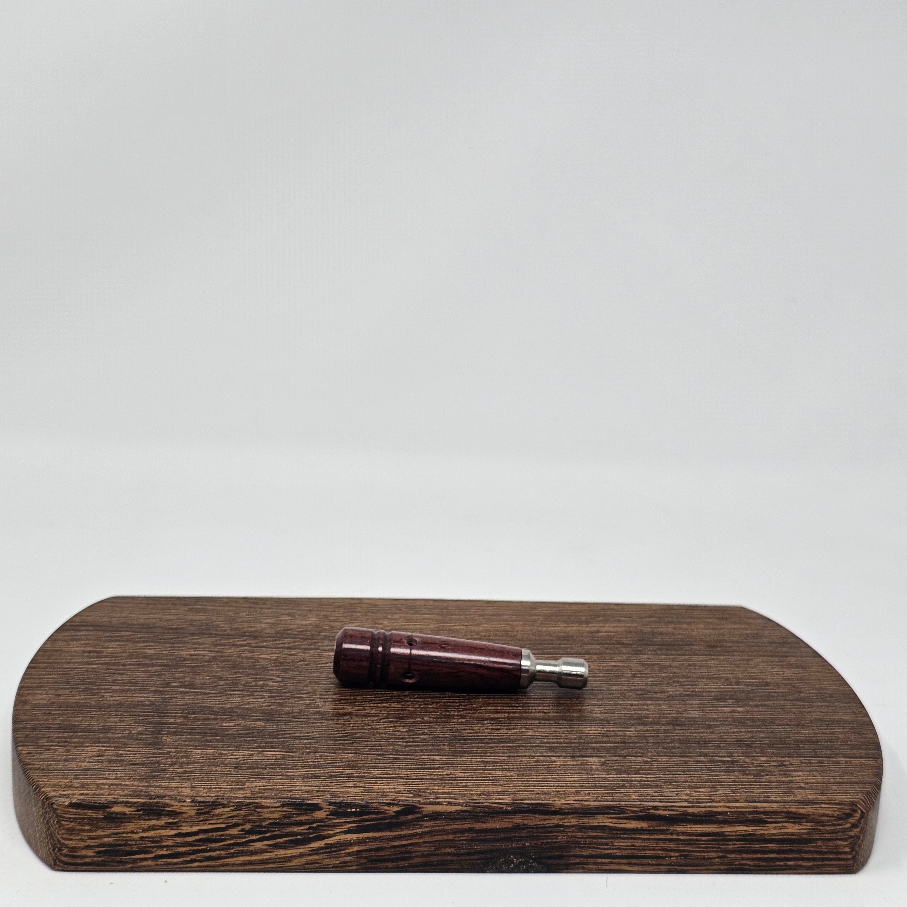 A Vietnamese Tracwood stem by Battery Free Ganz with a stainless steel lining to protect the wood from vapors.
New Design Features:
The new design does not have a carb on its body, making it more convenient to handle.
The wooden part has window holes, allowing you to see the stainless steel lining inside.
An air gap has been introduced between the wooden part and the stainless part. This enhancement is designed to improve the cooling function, allowing vapors to cool down faster and more efficiently.