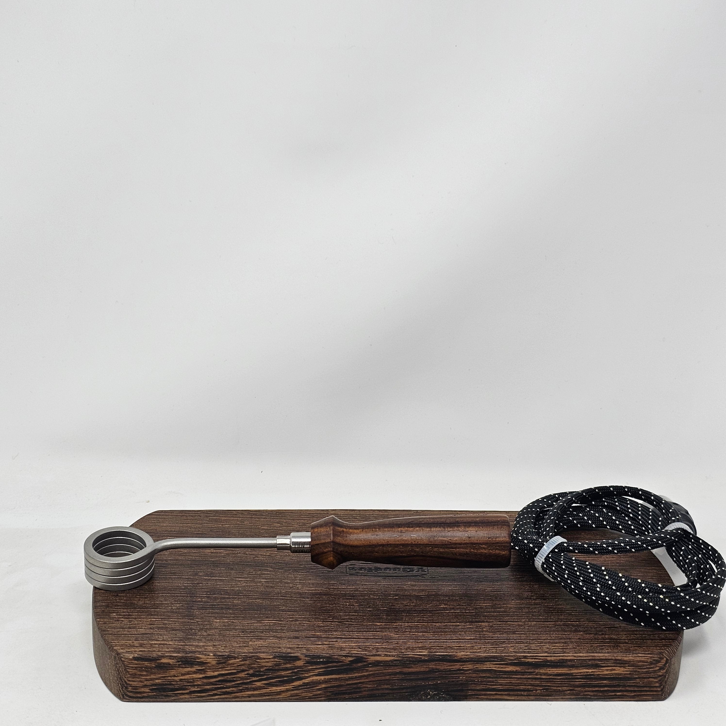 Crafted in Mississippi, this handled is not only beautiful but it makes for comfortable handling of your hot coil runners. Fits best with 20mm coils by Cannabis Hardware or Auber and requires no modification other than maybe a little electrical tape to keep it perfectly set. Will work with coils by Disorderly Conduction by removing the black rubber sheath around the coil clamp. Will NOT work with Auber 16mm coils.