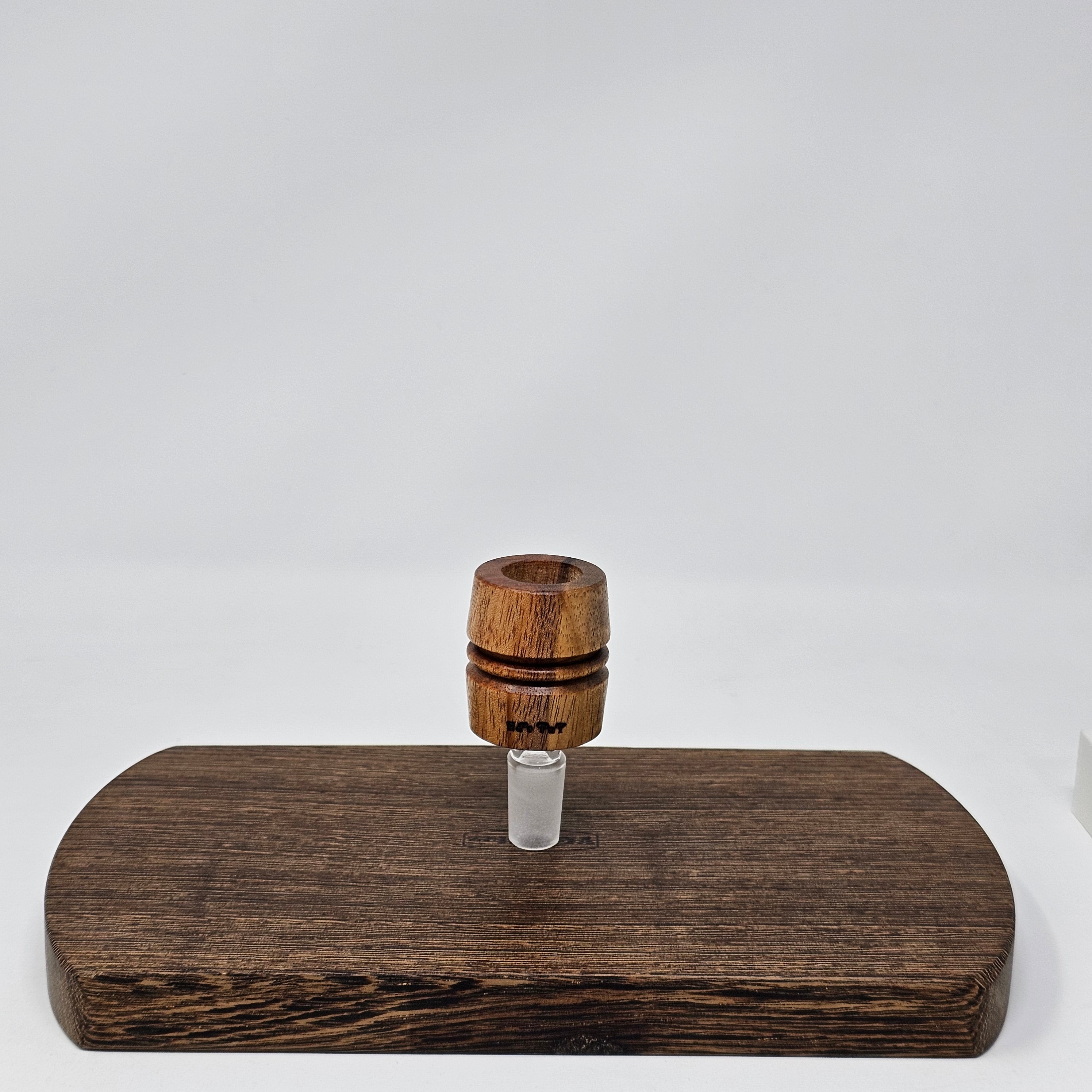 Hand made in Mississippi from Tigerwood. Tigerwood has a lot of color and grain variance so it may differ significantly from the picture.
Glass stand and CT8 not included in purchase just shown for demonstration.
Has a hands free fit with Ruby twist and a looser but airtight seal with CT8.