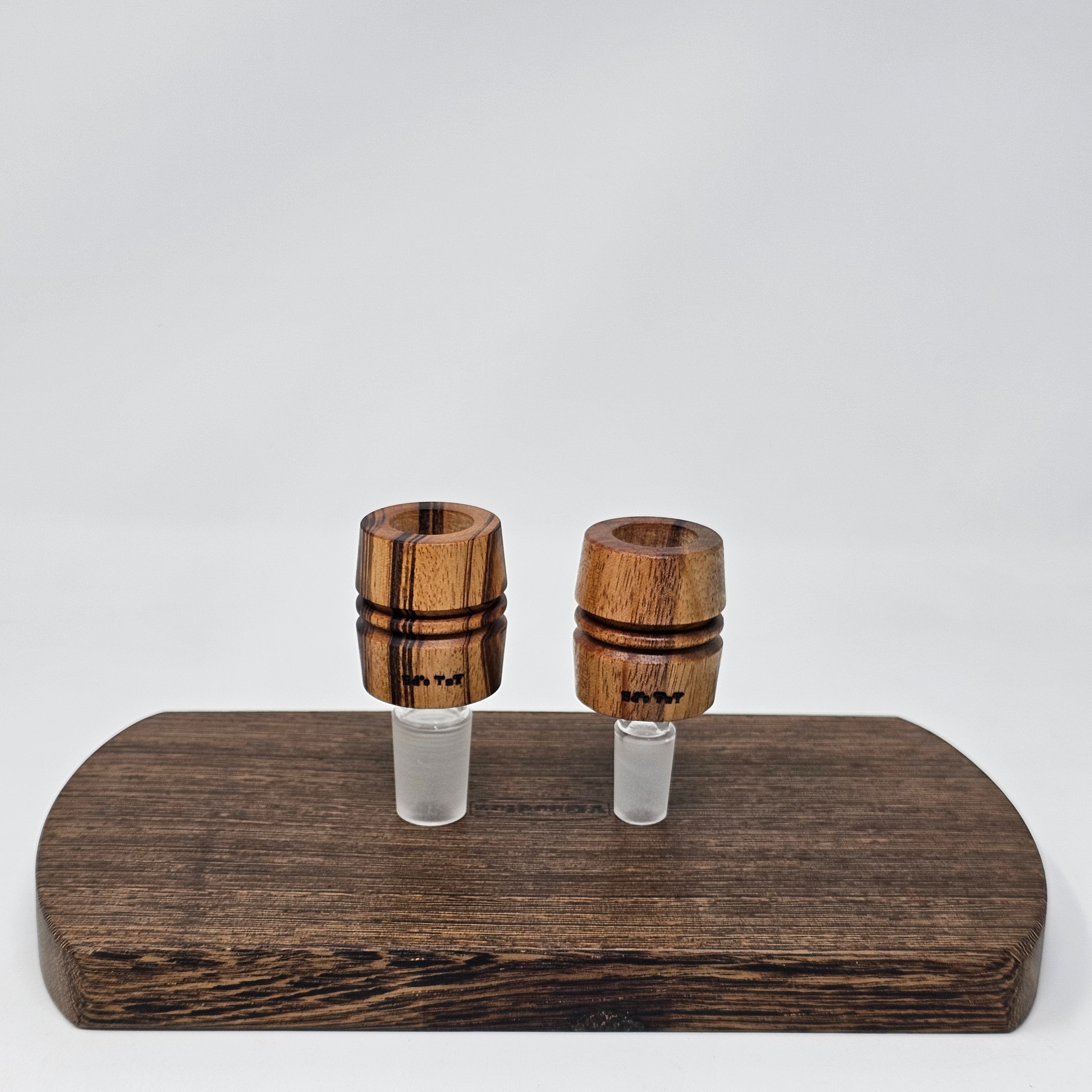 Hand made in Mississippi from Tigerwood.  Tigerwood has a lot of color and grain variance so it may differ significantly from the picture.
Glass stand and CT8 not included in purchase just shown for demonstration.
Has a hands free fit with Ruby twist and a looser but airtight seal with CT8.