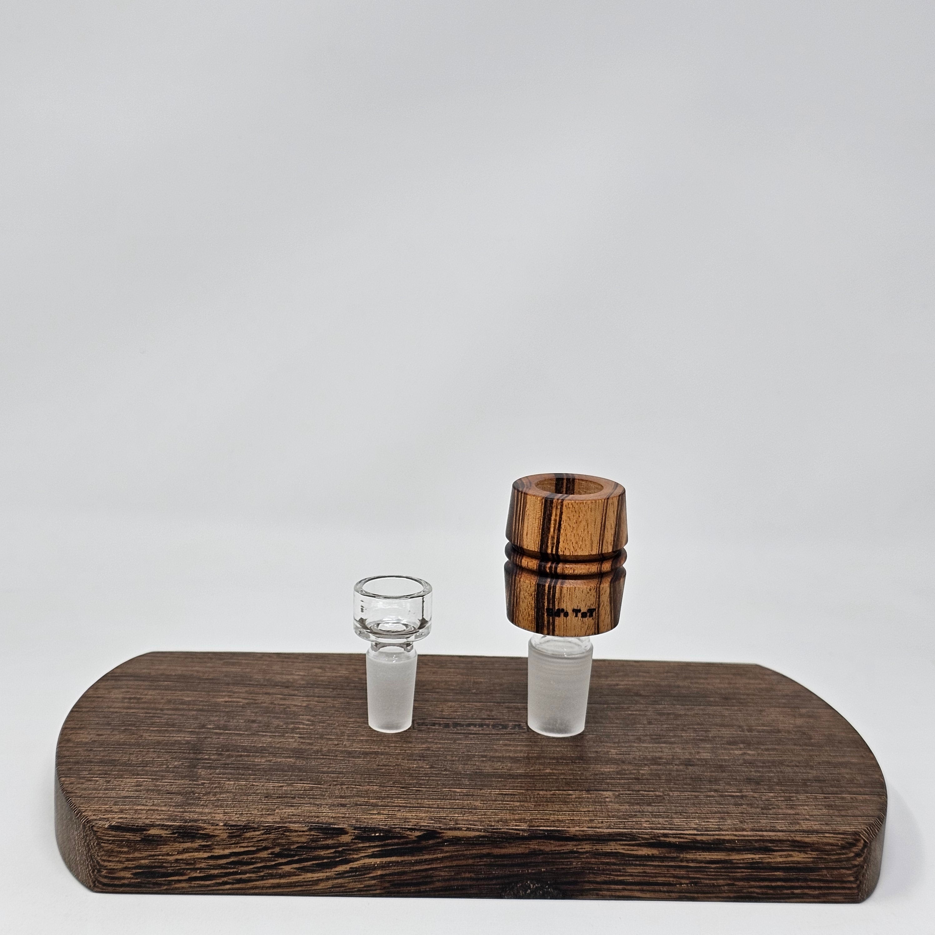 Hand made in Mississippi from Tigerwood. Tigerwood has a lot of color and grain variance so it may differ significantly from the picture.
Glass stand and CT8 not included in purchase just shown for demonstration.
Has a hands free fit with Ruby twist and a looser but airtight seal with CT8.