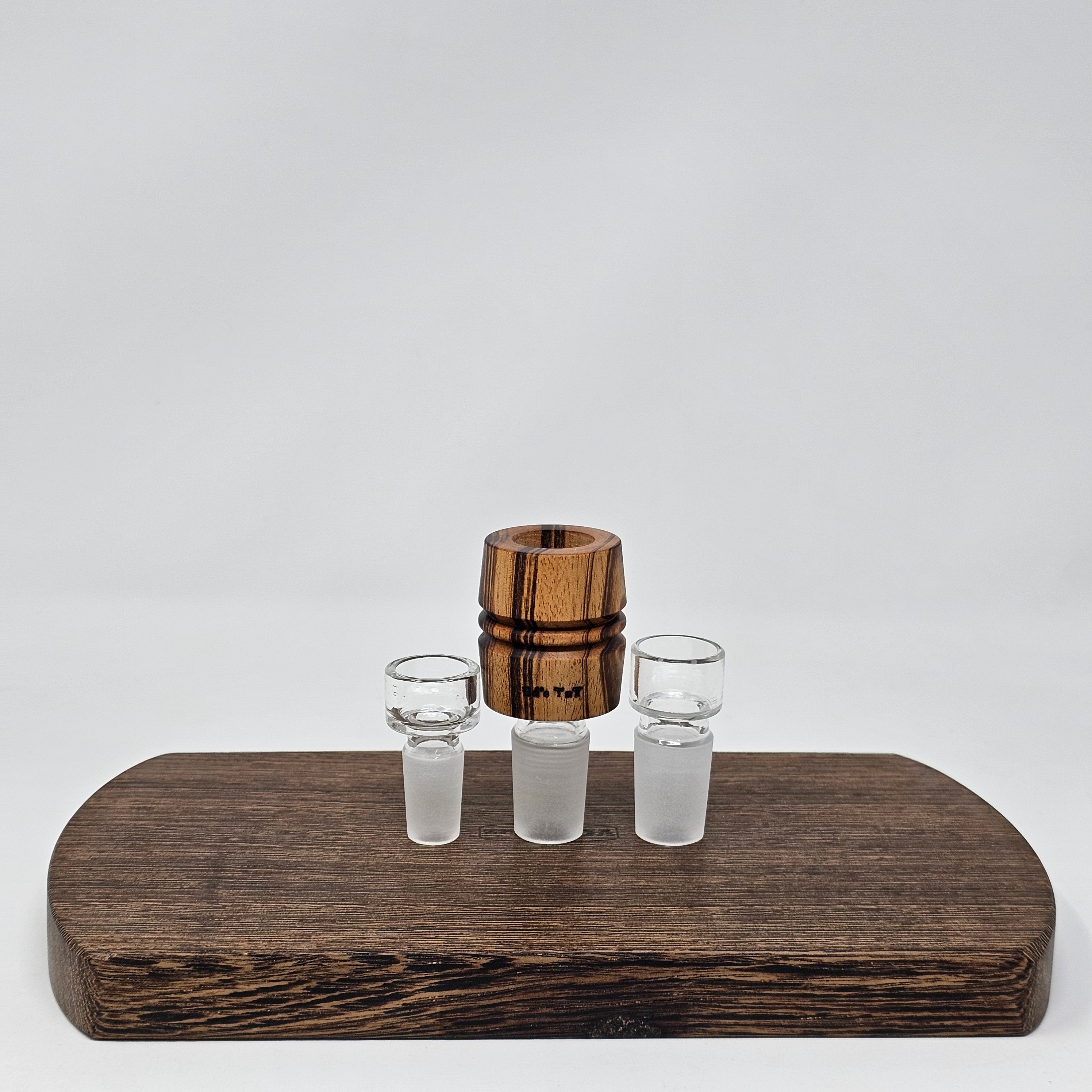 Hand made in Mississippi from Tigerwood. Tigerwood has a lot of color and grain variance so it may differ significantly from the picture.
Glass stand and CT8 not included in purchase just shown for demonstration.
Has a hands free fit with Ruby twist and a looser but airtight seal with CT8.