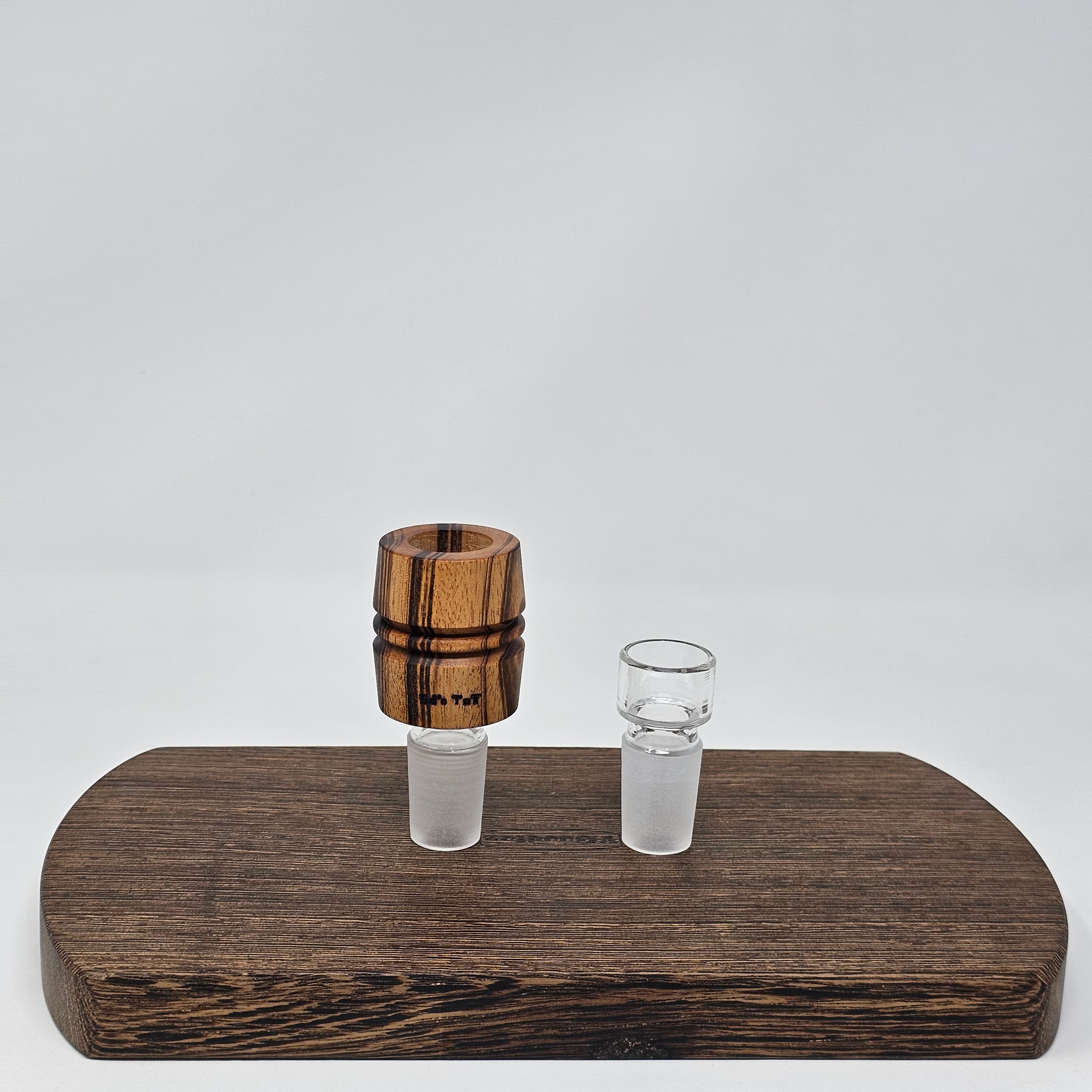 Hand made in Mississippi from Tigerwood.  Tigerwood has a lot of color and grain variance so it may differ significantly from the picture.
Glass stand and CT8 not included in purchase just shown for demonstration.
Has a hands free fit with Ruby twist and a looser but airtight seal with CT8.