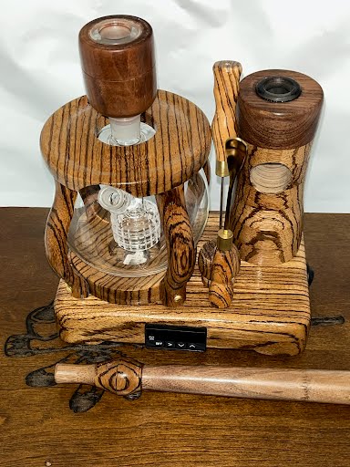 Made in a small family shop in the Southeast United States, each system is unique. This is a true conversation piece of functional art! Each set may contain different parts and of course will offer an individual mixture of woods and beauty only nature can provide.
This particular set includes:
24” whip and 12” wooden mouthpiece with Integrated Orb V2 Bracket System
Integrated PID Controller with US Standard Five Pin XLR Connection w/included Injector Stand
BN-LINK App C Controlled Smart WiFi Outlet Timer