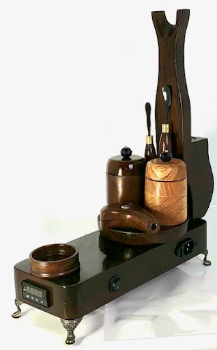 Made in a small family shop in the Southeast United States, each system is unique. This is a true conversation piece of functional art! The Club is 24 inches long and includes carb hole. Each set may contain different parts and of course will offer an individual mixture of woods and beauty only nature can provide.
This particular V1 set includes:
18” Club Pipe ( 1/4” bore) with integrated ash catcher filter system.
Integrated PID Controller with US Standard Five Pin XLR Connection w/included Injector…