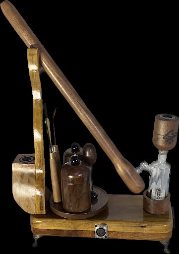 Made in a small family shop in the Southeast United States, each system is unique. This is a true conversation piece of functional art! The Club is 24 inches long and includes carb hole. Each set may contain different parts and of course will offer an individual mixture of woods and beauty only nature can provide.
This particular V1 set includes:
18” Club Pipe ( 1/4” bore) with integrated ash catcher filter system.
Integrated PID Controller with US Standard Five Pin XLR Connection w/included Injector…