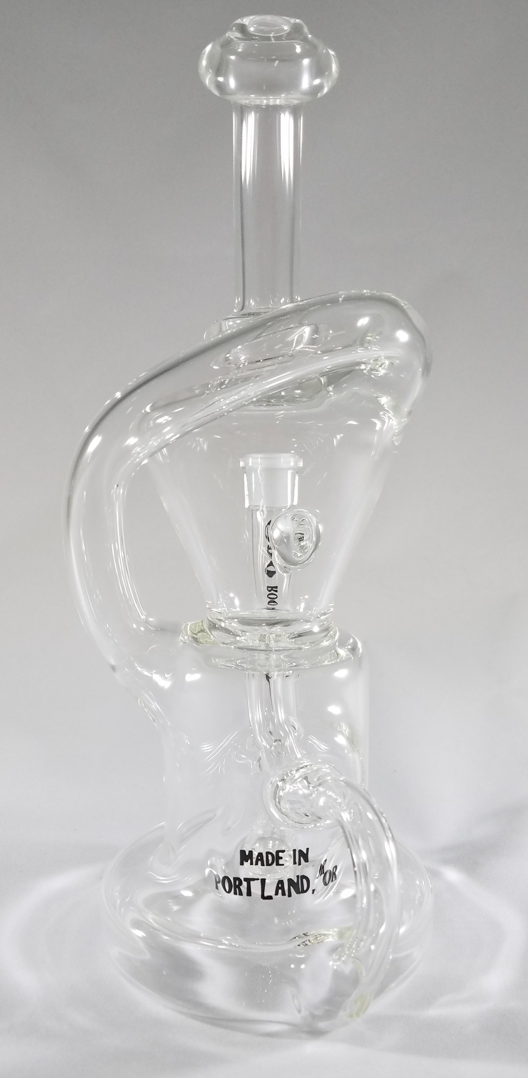 A Goo Roo Glass flagship rig, the Klein recycler has incredible function and appearance. Fitting is 14mm Female. Made in USA!
** This product is individually handmade by the same or different glass blower and there may be a variation in size of product. There could also be a variation in the logo size, placement, and color…