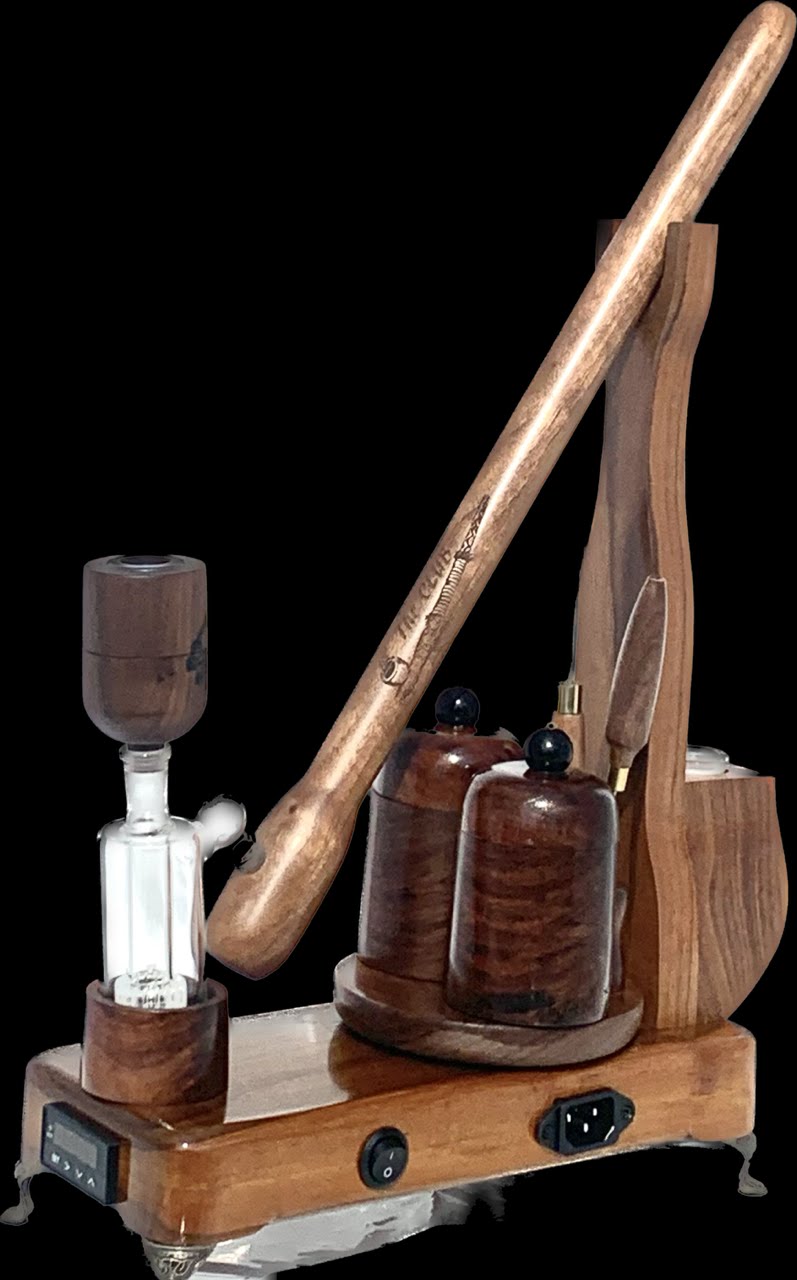 Made in a small family shop in the Southeast United States, each system is unique. This is a true conversation piece of functional art! The Club is 24 inches long and includes carb hole. Each set may contain different parts and of course will offer an individual mixture of woods and beauty only nature can provide.
This particular V1 set includes:
18” Club Pipe ( 1/4” bore) with integrated ash catcher filter system.
Integrated PID Controller with US Standard Five Pin XLR Connection w/included Injector…