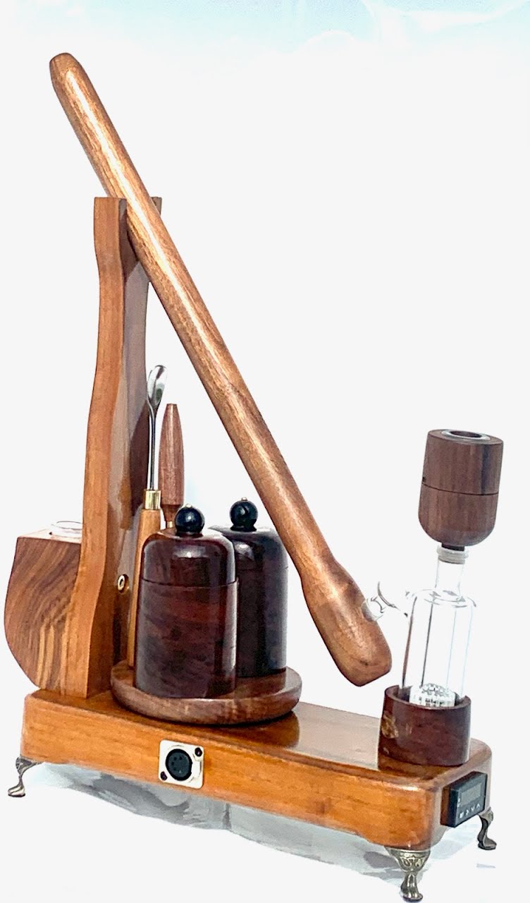 Made in a small family shop in the Southeast United States, each system is unique. This is a true conversation piece of functional art! The Club is 24 inches long and includes carb hole. Each set may contain different parts and of course will offer an individual mixture of woods and beauty only nature can provide.
This particular V1 set includes:
18” Club Pipe ( 1/4” bore) with integrated ash catcher filter system.
Integrated PID Controller with US Standard Five Pin XLR Connection w/included Injector…