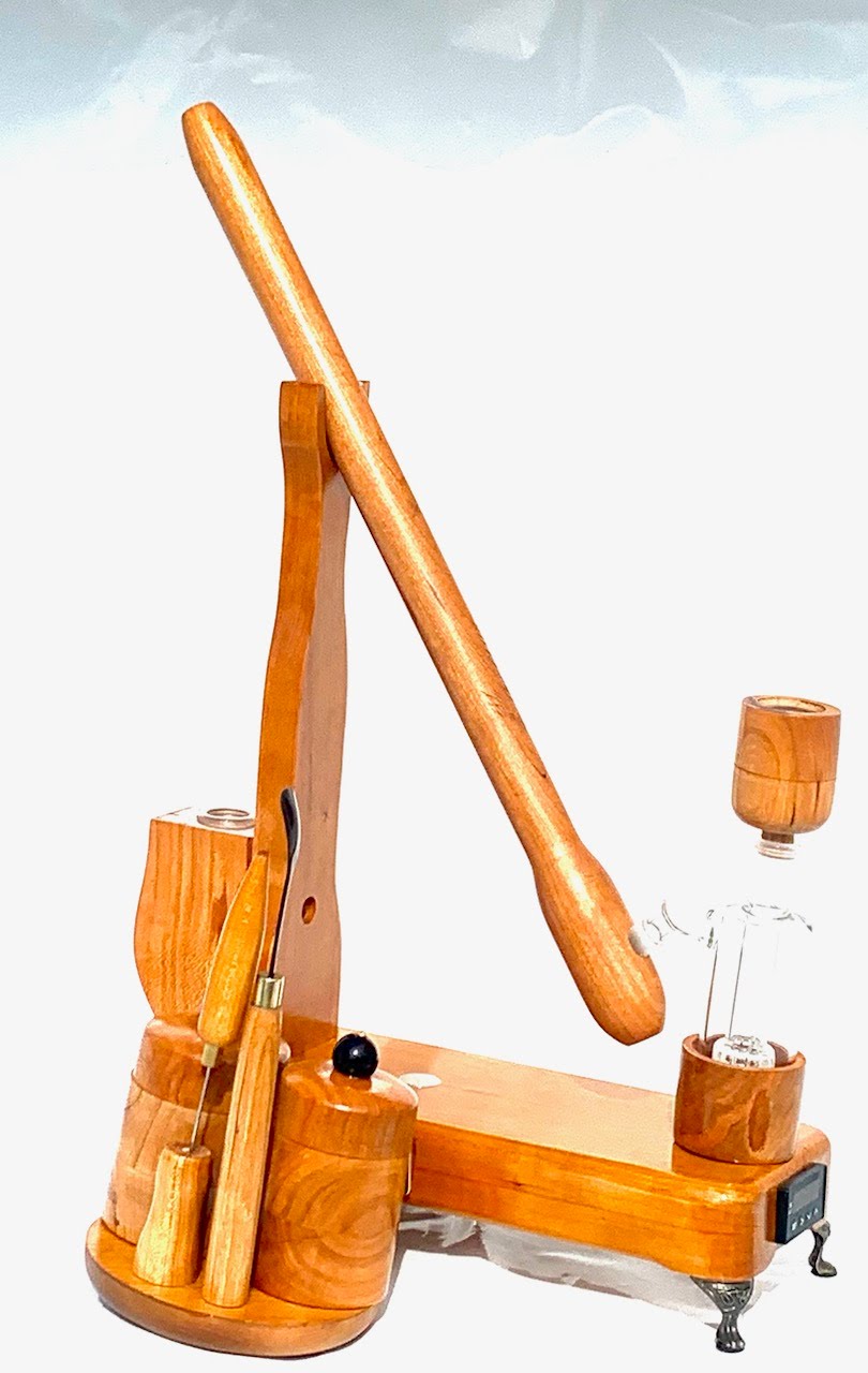 Made in a small family shop in the Southeast United States, each system is unique. This is a true conversation piece of functional art! The Club is 24 inches long and includes carb hole. Each set may contain different parts and of course will offer an individual mixture of woods and beauty only nature can provide.
This particular V1 set includes:
18” Club Pipe ( 1/4” bore) with integrated ash catcher filter system.
Integrated PID Controller with US Standard Five Pin XLR Connection w/included Injector…
