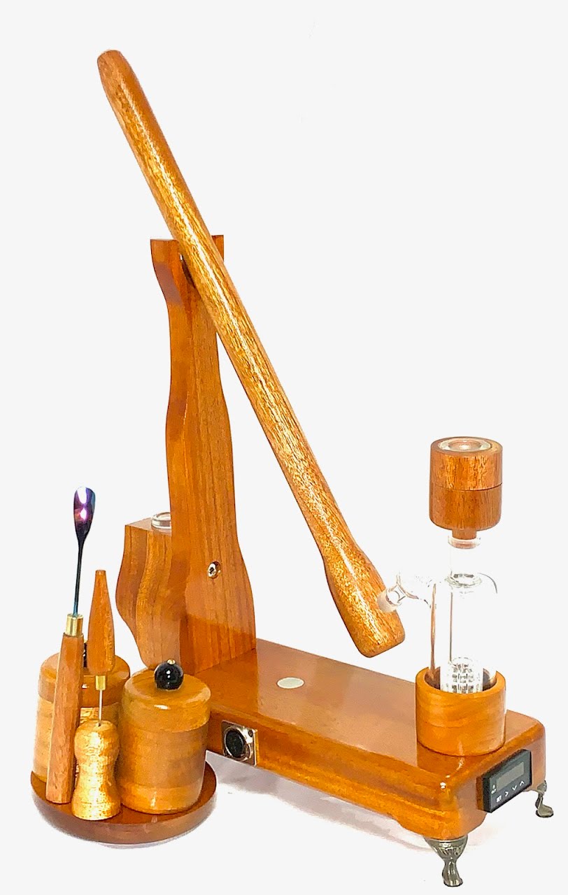 Made in a small family shop in the Southeast United States, each system is unique. This is a true conversation piece of functional art! The Club is 24 inches long and includes carb hole. Each set may contain different parts and of course will offer an individual mixture of woods and beauty only nature can provide.
This particular V1 set includes:
18” Club Pipe ( 1/4” bore) with integrated ash catcher filter system.
Integrated PID Controller with US Standard Five Pin XLR Connection w/included Injector…