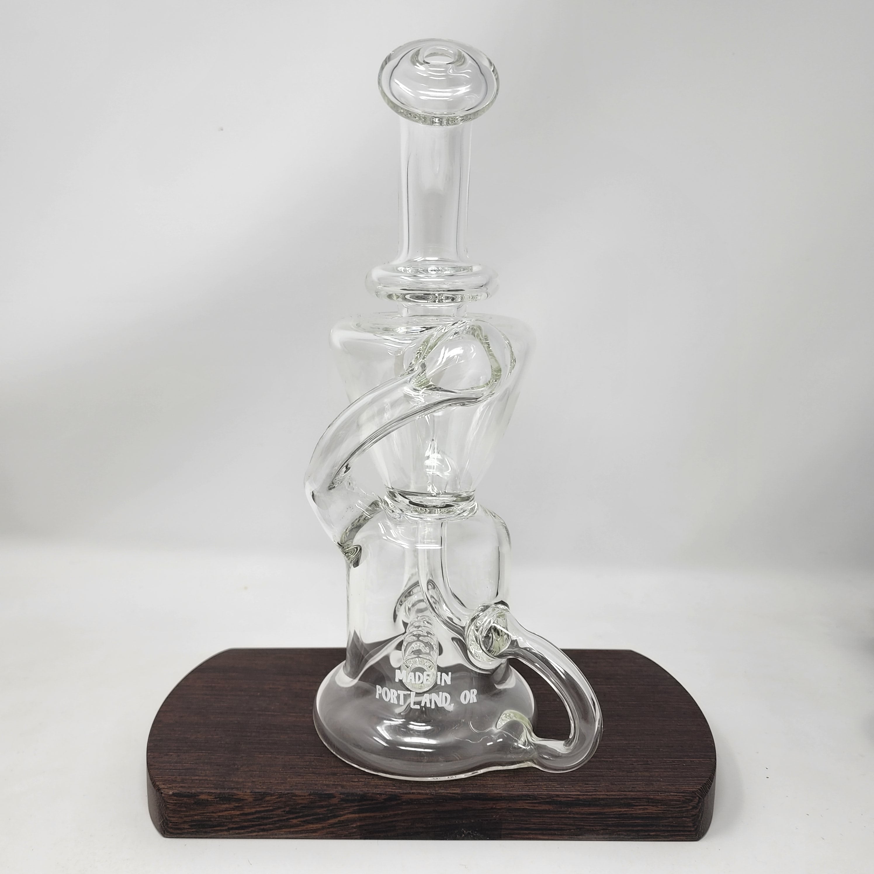 A Goo Roo Glass flagship rig, the Klein recycler has incredible function and appearance. Fitting is 14mm Female. Made in USA!
** This product is individually handmade by the same or different glass blower and there may be a variation in size of product. There could also be a variation in the logo size, placement, and color…