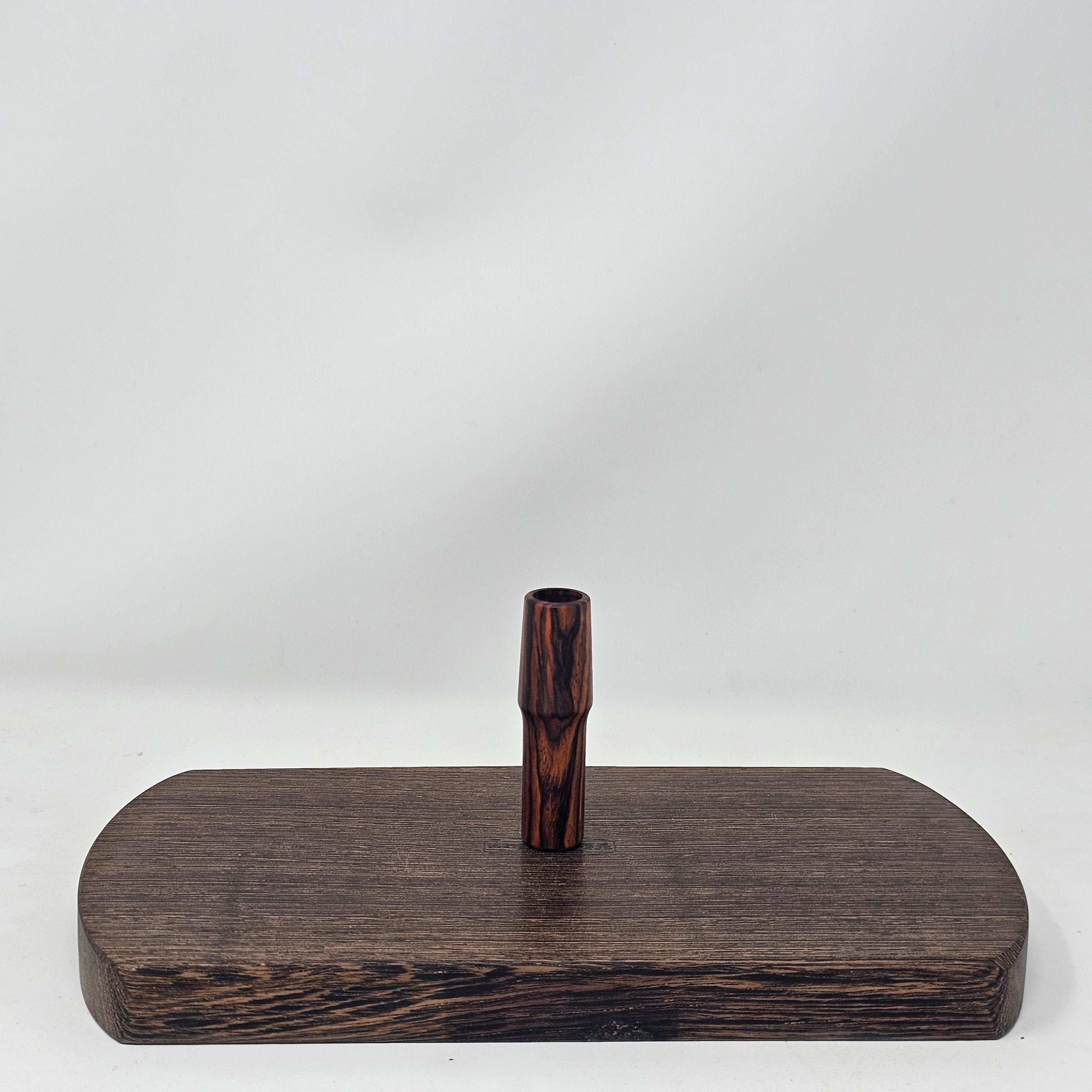 Made from Cocobolo at 2 1/2"L with the same bore as the longer stems as well as the glass. Are tapered to 19mm at the mouth piece for your favorite water tool or can be used easily as a stem alone. Comes with two conical screens. 19mm only.
