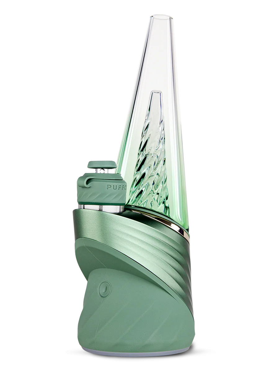 The Peak Pro (2023) is the pinnacle of hash technology. This premium smart rig delivers incredible flavor and unparalleled performance. Unlock the fullest potential of the plant with its single-button interface, deep customization via the Puffco Connect app, and patented 3D Chamber. Featuring the Joystick Cap and laser cut perc slots for improved water filtration. Currently available in Black and Pearl White.