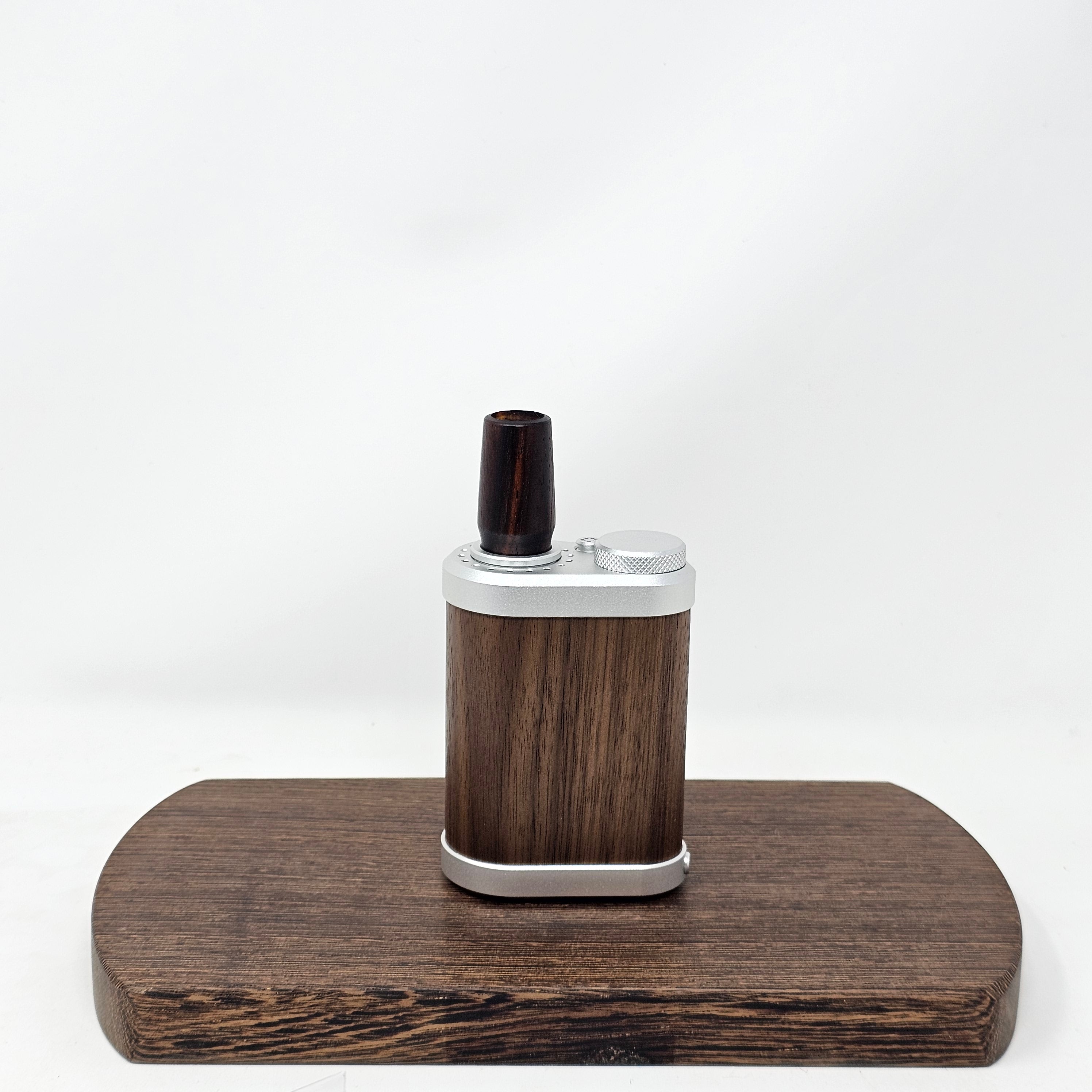 Made from Cocobolo at 2 1/2"L with the same bore as the longer stems as well as the glass. Are tapered to 19mm at the mouth piece for your favorite water tool or can be used easily as a stem alone. Comes with two conical screens. 19mm only.