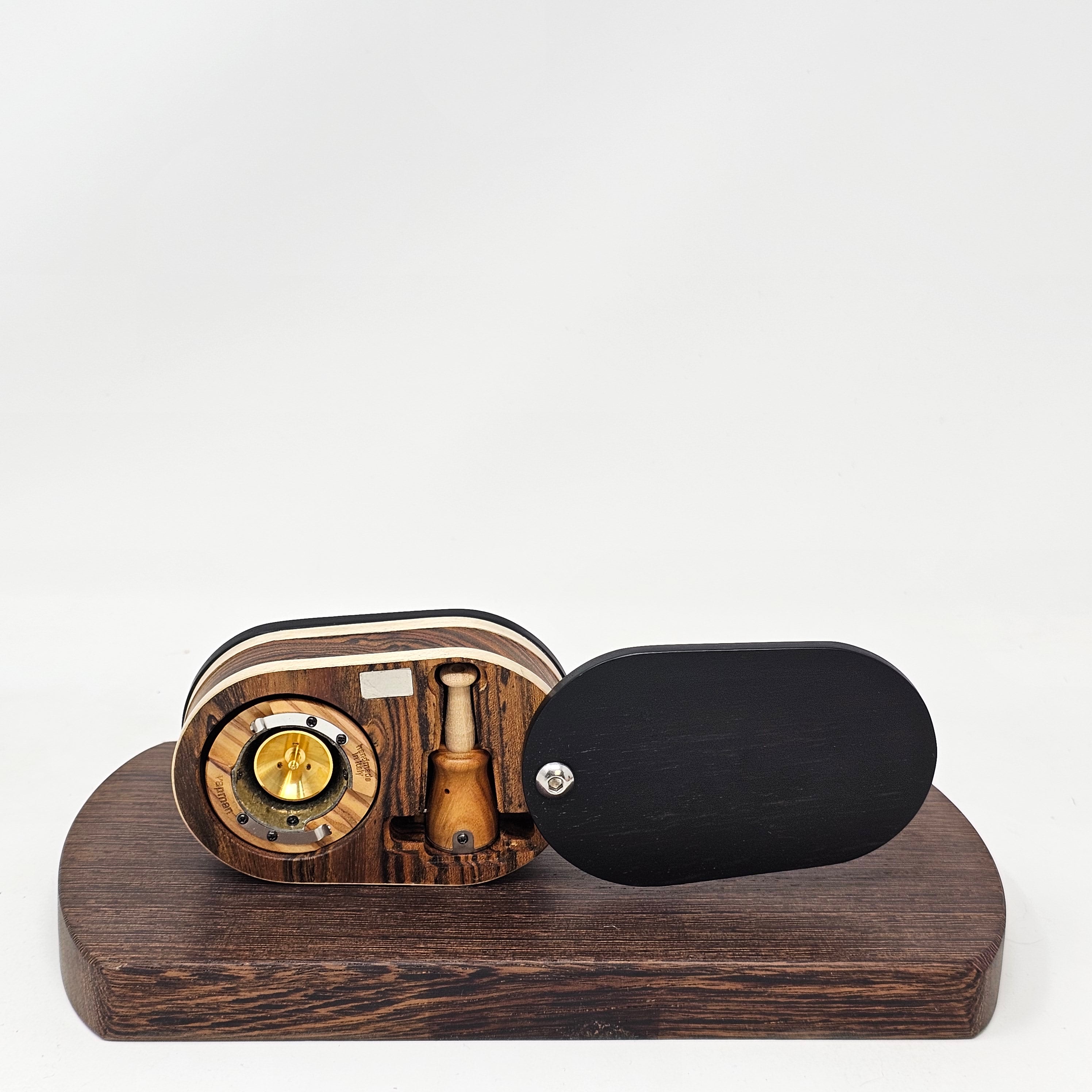 Vapman Case in Bocote/Sycamore/Ebony.&nbsp;&nbsp;

Handcrafted in the United Kingdom by PhattPiggie.&nbsp;&nbsp;

You are purchasing one Vapman case. No Vapman unit is included. One is shown for demonstration purposes only. Case operates with a rotating magnetic lid.