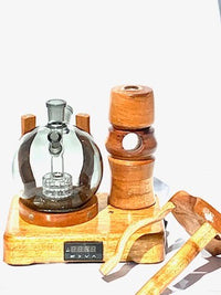 Made in a small family shop in the Southeast United States, each system is unique. This is a true conversation piece of functional art! Each set may contain different parts and of course will offer an individual mixture of woods and beauty only nature can provide.

This particular set includes:

24” whip and 12” wooden mouthpiece with Integrated Orb V2 Bracket System
Integrated PID Controller with US Standard Five Pin XLR Connection w/included Injector Stand
BN-LINK App C Controlled Smart WiFi Outlet Timer