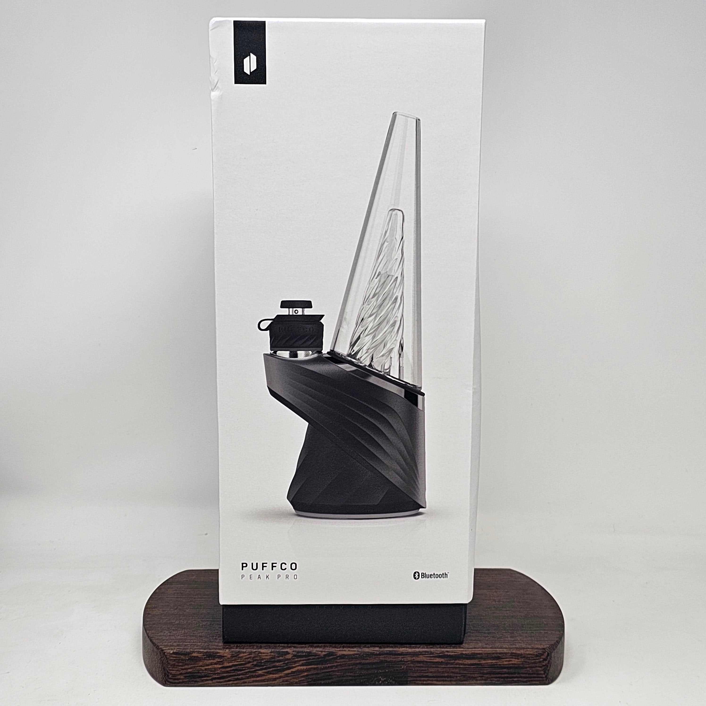 The Peak Pro (2023) is the pinnacle of hash technology. This premium smart rig delivers incredible flavor and unparalleled performance. Unlock the fullest potential of the plant with its single-button interface, deep customization via the Puffco Connect app, and patented 3D Chamber. Featuring the Joystick Cap and laser cut perc slots for improved water filtration. Currently available in Black and Pearl White.