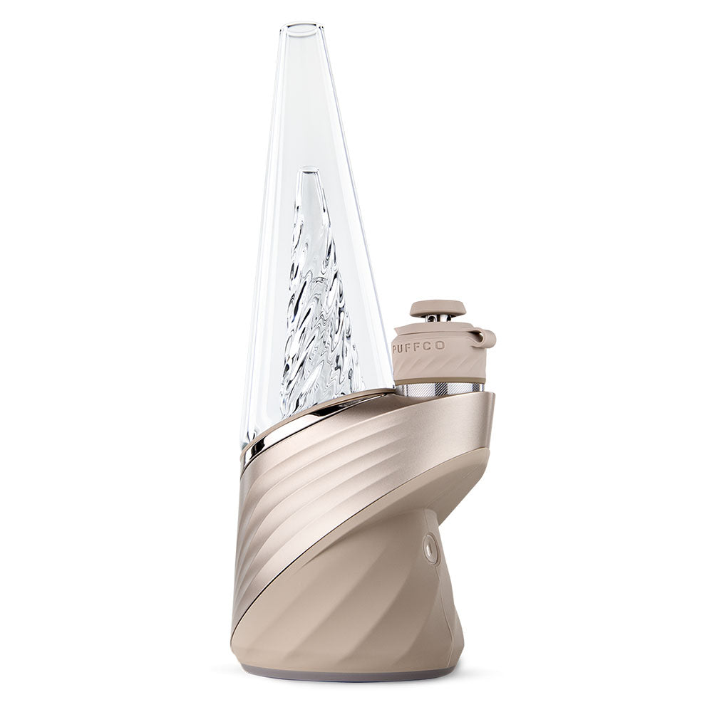 The Peak Pro (2023) is the pinnacle of hash technology. This premium smart rig delivers incredible flavor and unparalleled performance. Unlock the fullest potential of the plant with its single-button interface, deep customization via the Puffco Connect app, and patented 3D Chamber. Featuring the Joystick Cap and laser cut perc slots for improved water filtration. Currently available in Black and Pearl White.