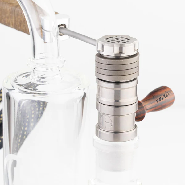 The new Flowerpot F22 Head is created at a time where ball vapes require some refinement. This new Flowerpot head packs a punch as the heat sink is improved by the addition of a solid titanium machined cap and a machined screen at the bottom which further improves the conduction and retention of heat throughout the device.

There are two barrel designs, the F22 barrel is a "standard" style "female" head which will sit on the outside of the shovelhead bowl and any other 22mm bowl.