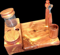 Made in a small family shop in the Southeast United States, each system is unique. This is a true conversation piece of functional art! Each set may contain different parts and of course will offer an individual mixture of woods and beauty only nature can provide.

This particular set includes:

Handmade 6” by 8” Workstation in Cedar
Two Herb Jars
Pick Tool
Stir Tool
Wood Cleaning Brush