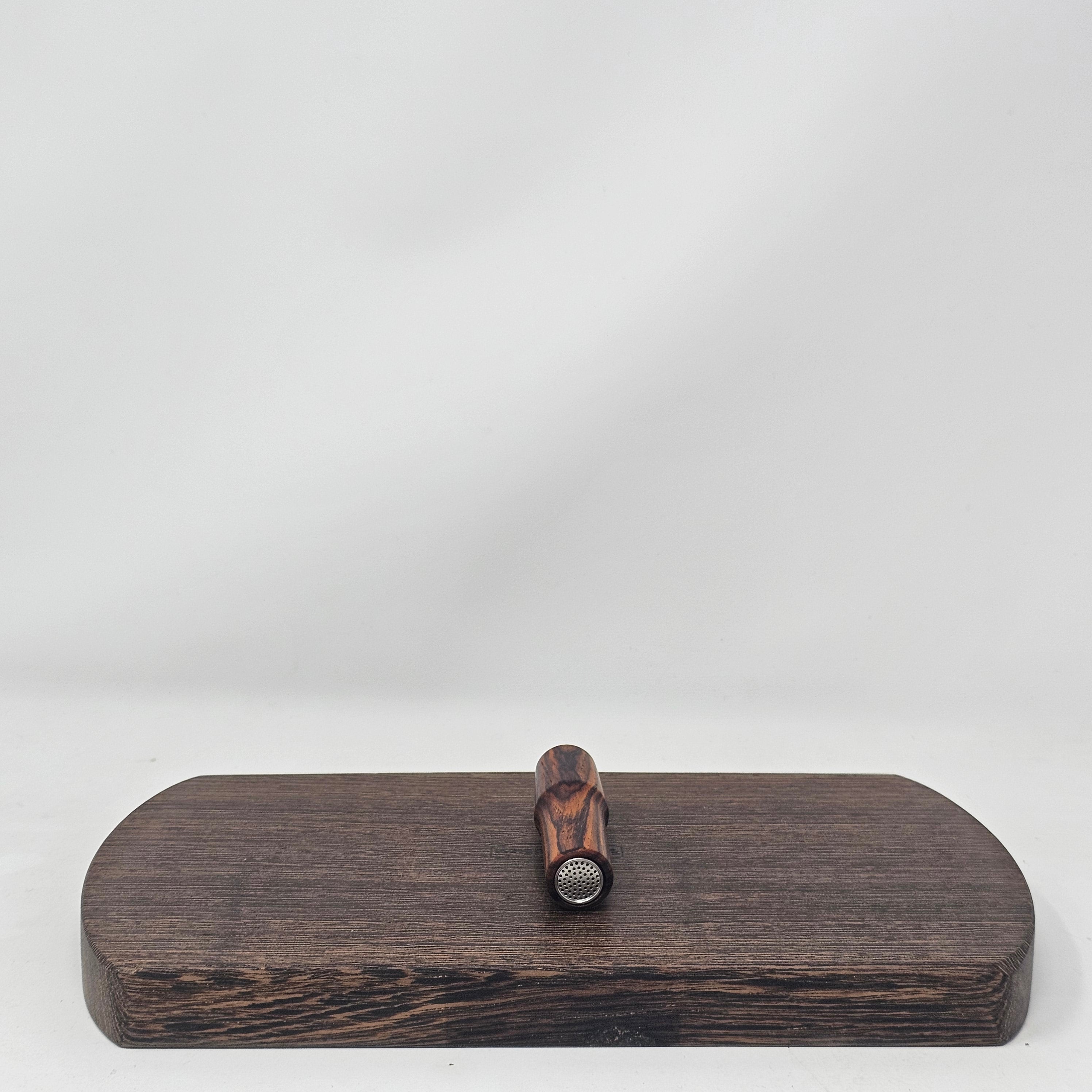 Made from Cocobolo at 2 1/2"L with the same bore as the longer stems as well as the glass. Are tapered to 19mm at the mouth piece for your favorite water tool or can be used easily as a stem alone. Comes with two conical screens. 19mm only.