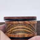 Vapman Case in Redheart/Acrylic/Maple Burl/Bocote.

Handcrafted in the United Kingdom by PhattPiggie.

You are purchasing one Vapman case. No Vapman unit is included. One is shown for demonstration purposes only. Case operates with a rotating magnetic lid.