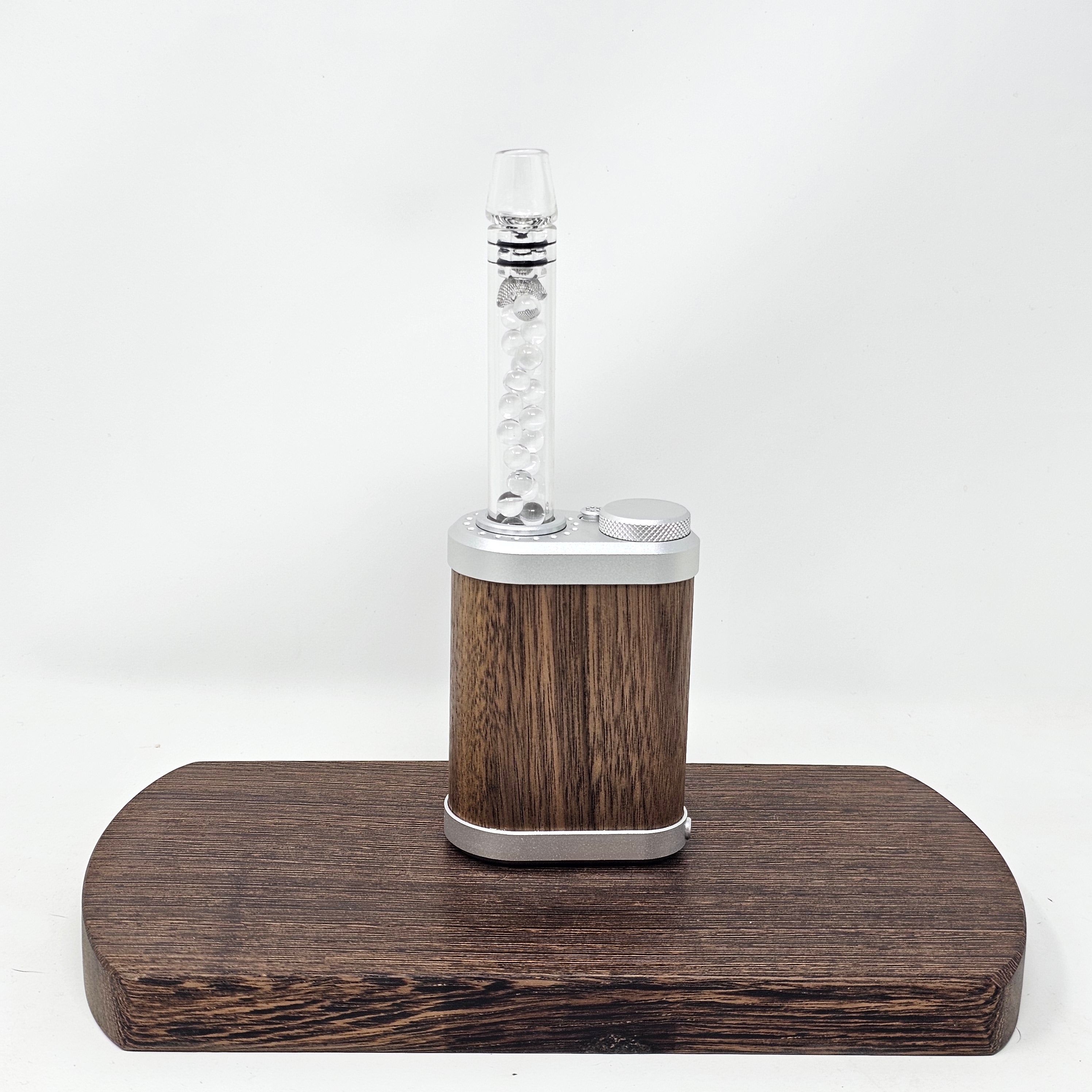 Cool your Tinymight with this bead filled stem! More streamline than our larger Rocket Stem. Includes removable comfort Glass Tip which allows access to the cooling balls for cleaning.

Filled with 6mm quartz balls for cooling. Built in glass screen. Also will accept conical or basket screens as well as dosing caps.