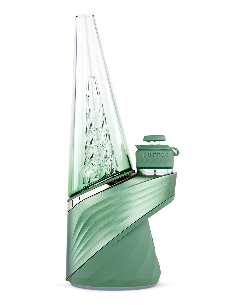 The Peak Pro (2023) is the pinnacle of hash technology. This premium smart rig delivers incredible flavor and unparalleled performance. Unlock the fullest potential of the plant with its single-button interface, deep customization via the Puffco Connect app, and patented 3D Chamber. Featuring the Joystick Cap and laser cut perc slots for improved water filtration. Currently available in Black and Pearl White.