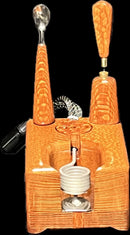 Made in a small family shop in the Southeast United States, each system is unique. This is a true conversation piece of functional art! Each set may contain different parts and of course will offer an individual mixture of woods and beauty only nature can provide.

This particular set includes:

Handmade Leopardwood Dock with Coil Clamp
Leopardwood Wireless Handle and Bowl Set
Scoop and Stir Tool
Optional 25mm Axial Coil
Optional Heater and Bowl Set