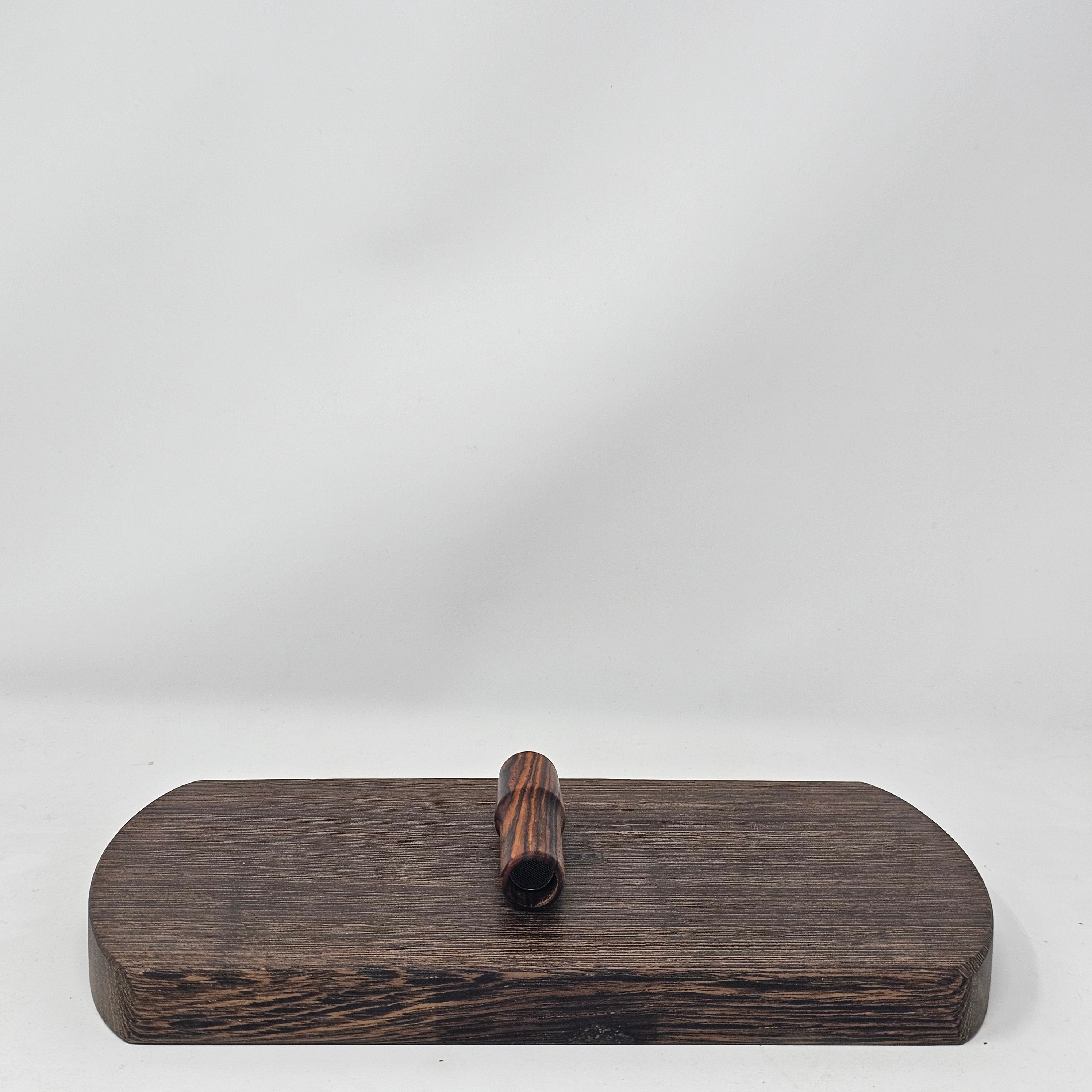 Made from Cocobolo at 2 1/2"L with the same bore as the longer stems as well as the glass. Are tapered to 19mm at the mouth piece for your favorite water tool or can be used easily as a stem alone. Comes with two conical screens. 19mm only.