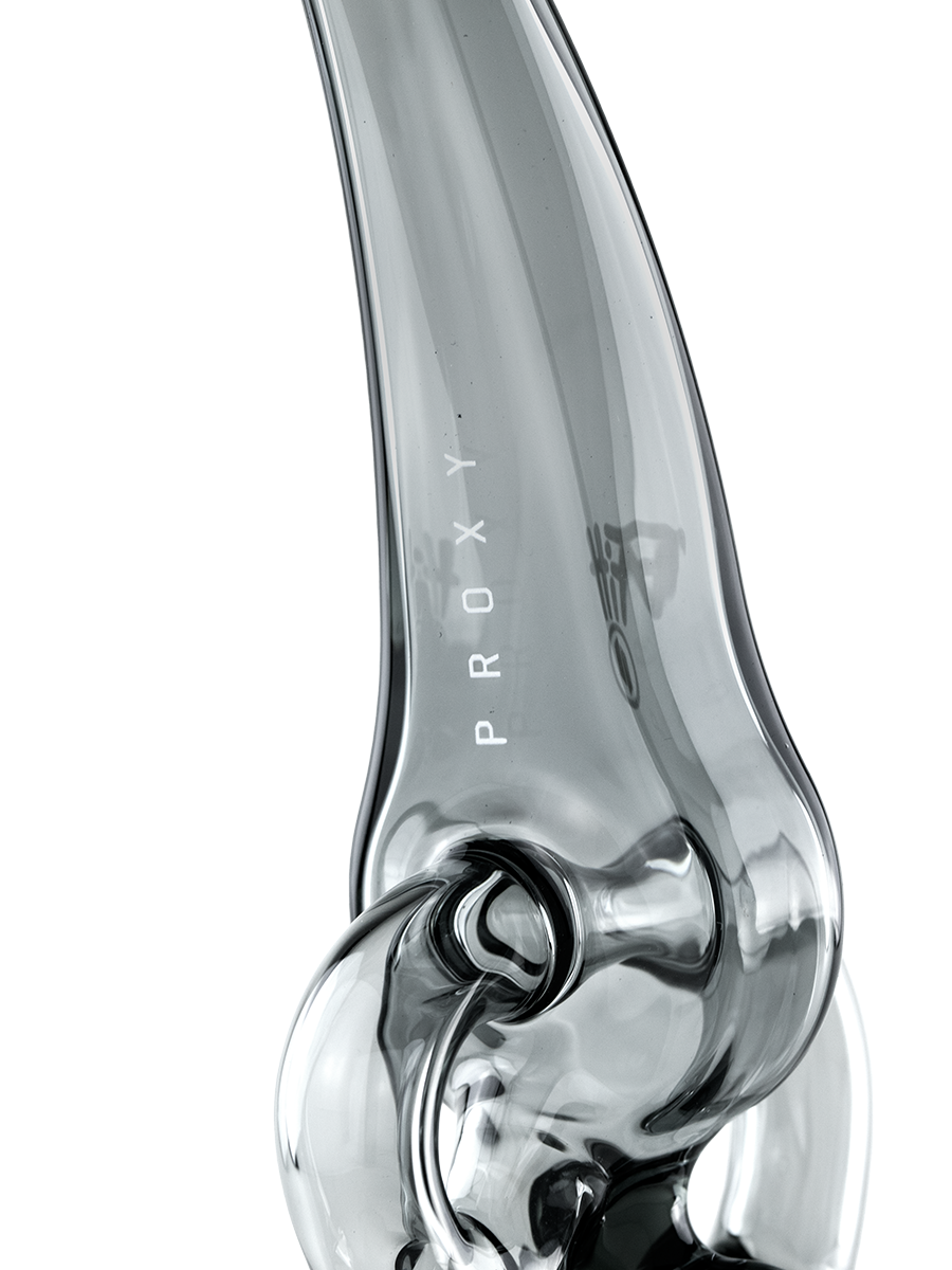 Master glassblower Ryan Fitt has done it again. Beautiful and balanced, the Proxy Ryan Fitt Recycler delivers bigger, cooler hits with Ryan’s signature recycling action and style. This borosilicate glass Piece is the latest in the Puffco Proxy Collection, fitting comfortably in hand and effortlessly blending performance and portability.
