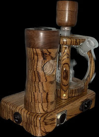 Made in a small family shop in the Southeast United States, each system is unique. This is a true conversation piece of functional art! Each set may contain different parts and of course will offer an individual mixture of woods and beauty only nature can provide.

This particular set includes:

24” whip and 12” wooden mouthpiece with Integrated Orb V2 Bracket System
Integrated PID Controller with US Standard Five Pin XLR Connection w/included Injector Stand
BN-LINK App C Controlled Smart WiFi Outlet Timer