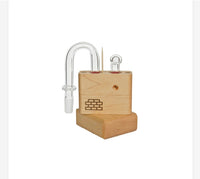 Our U-Joint for the Sticky Brick Junior and Runt replaces your mouthpiece and gives a direct 14.4mm male connection to use with your favorite glass. Made in Asheville North Carolina from our normal thick ass glass and carries a 15 day warranty against defects. The U-Joint will ship with an additional o-ring and carb cork.

Vaporizers for display purposes only and not included in sale.