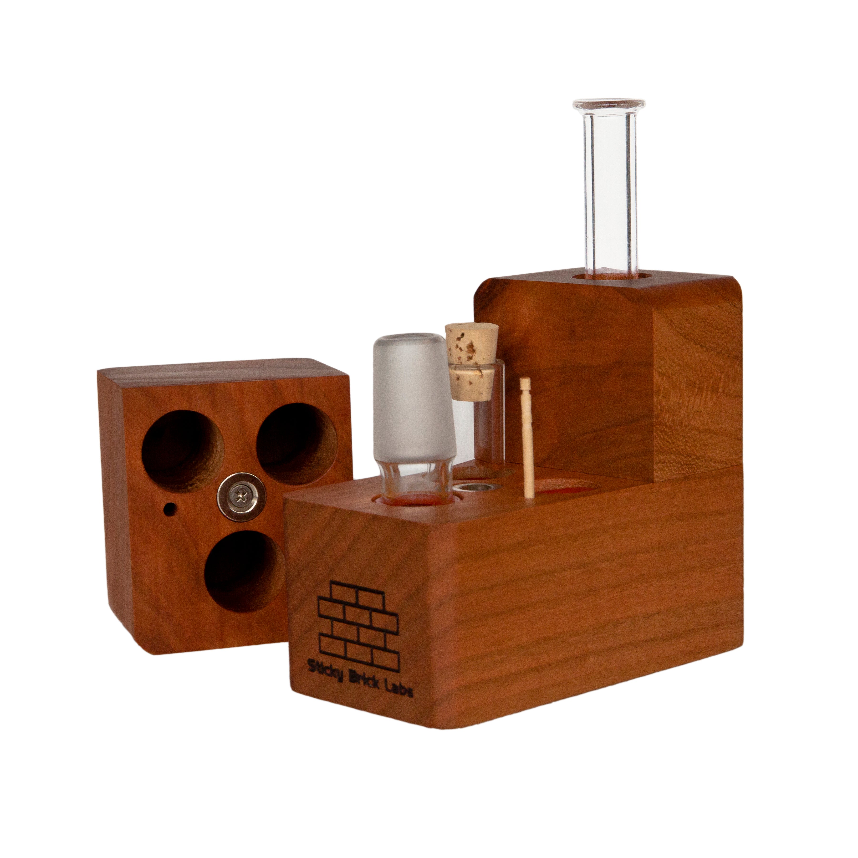 The Sticky Brick Maxx is available in a variety of wood choices. Ships with a torch, 18mm female, 18mm male, and 14mm male whip connectors along with 16” of silicone whip tubing, 18mm female dry mouthpiece, 6-pack of screens, carb corks, an extra jar cork, and led tweezers. Now ships with two Restrictor Discs.