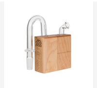 Our U-Joint for the Sticky Brick Junior and Runt replaces your mouthpiece and gives a direct 14.4mm male connection to use with your favorite glass. Made in Asheville North Carolina from our normal thick ass glass and carries a 15 day warranty against defects. The U-Joint will ship with an additional o-ring and carb cork.

Vaporizers for display purposes only and not included in sale.