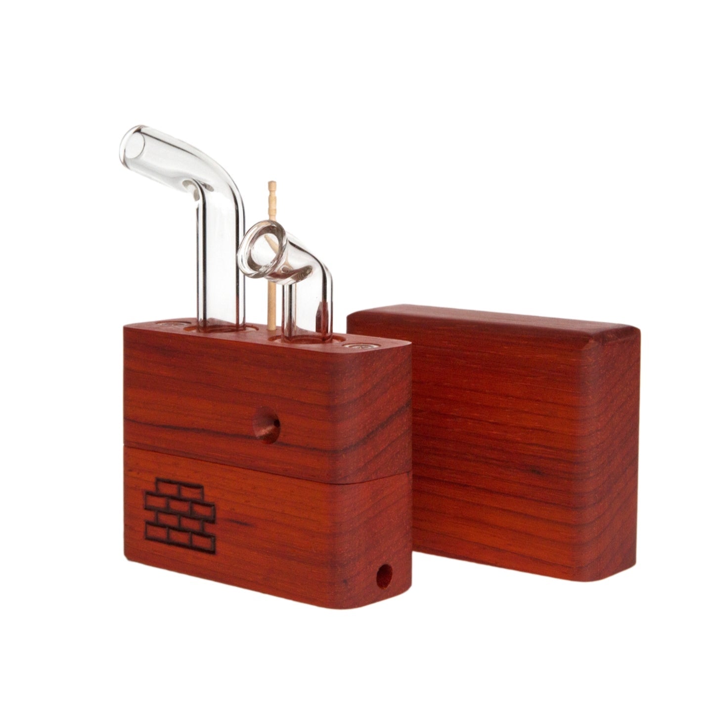 The Sticky Brick Junior is our butane-powered portable. Measuring 4.5 inches tall, 3 inches wide, and 1 inch thick, it will fit right in your pocket or bag to take on the go. The protective cap secures with the same extra-strong, rare earth magnets that we use in all of our devices. As with all of our Sticky Bricks, the wooden body and the glass are worked by hand right here in our workshop.