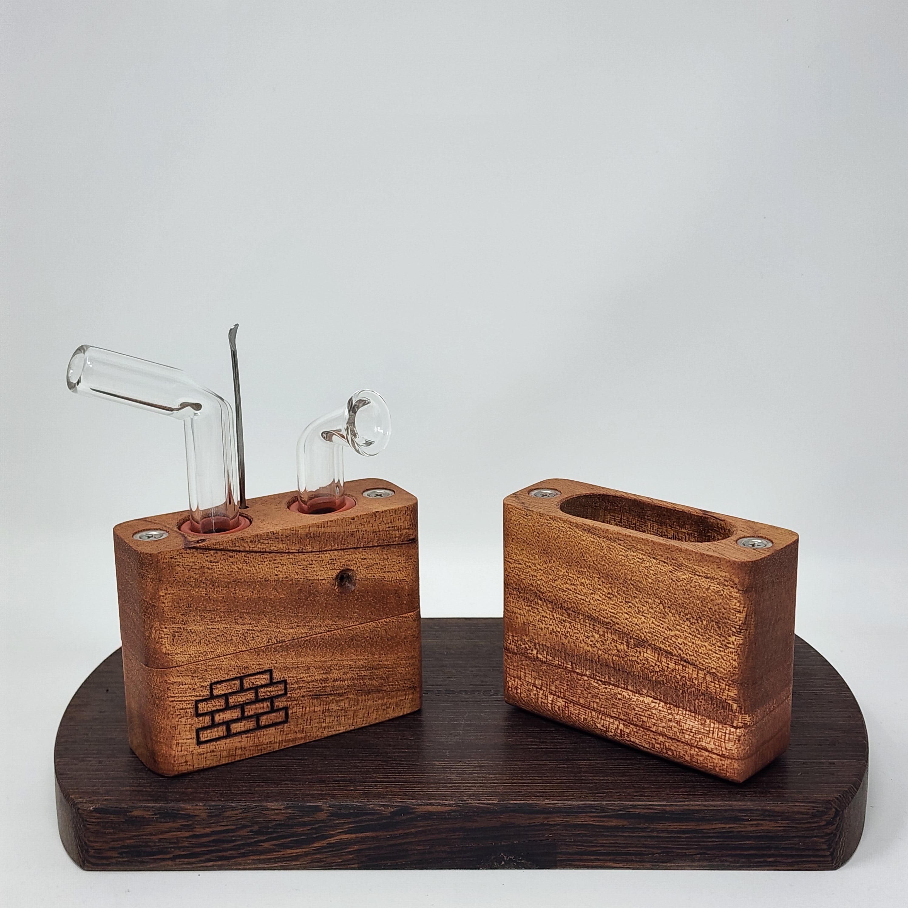 The Sticky Brick Junior is our butane-powered portable. Measuring 4.5 inches tall, 3 inches wide, and 1 inch thick, it will fit right in your pocket or bag to take on the go. The protective cap secures with the same extra-strong, rare earth magnets that we use in all of our devices. As with all of our Sticky Bricks, the wooden body and the glass are worked by hand right here in our workshop.
