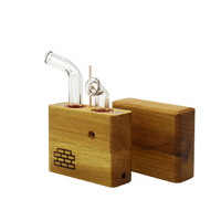 The Sticky Brick Junior is our butane-powered portable. Measuring 4.5 inches tall, 3 inches wide, and 1 inch thick, it will fit right in your pocket or bag to take on the go. The protective cap secures with the same extra-strong, rare earth magnets that we use in all of our devices. As with all of our Sticky Bricks, the wooden body and the glass are worked by hand right here in our workshop.