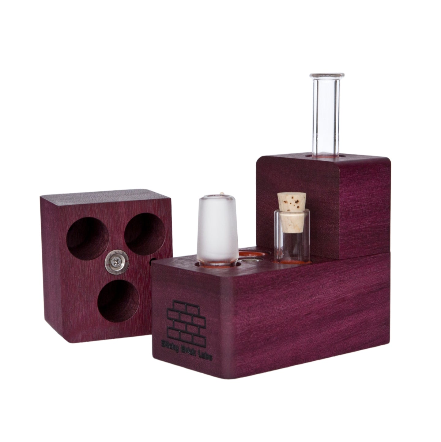 The Sticky Brick Maxx is available in a variety of wood choices. Ships with a torch, 18mm female, 18mm male, and 14mm male whip connectors along with 16” of silicone whip tubing, 18mm female dry mouthpiece, 6-pack of screens, carb corks, an extra jar cork, and led tweezers. Now ships with two Restrictor Discs.