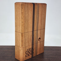 The Sticky Brick Junior is our butane-powered portable. Measuring 4.5 inches tall, 3 inches wide, and 1 inch thick, it will fit right in your pocket or bag to take on the go. The protective cap secures with the same extra-strong, rare earth magnets that we use in all of our devices. As with all of our Sticky Bricks, the wooden body and the glass are worked by hand right here in our workshop.