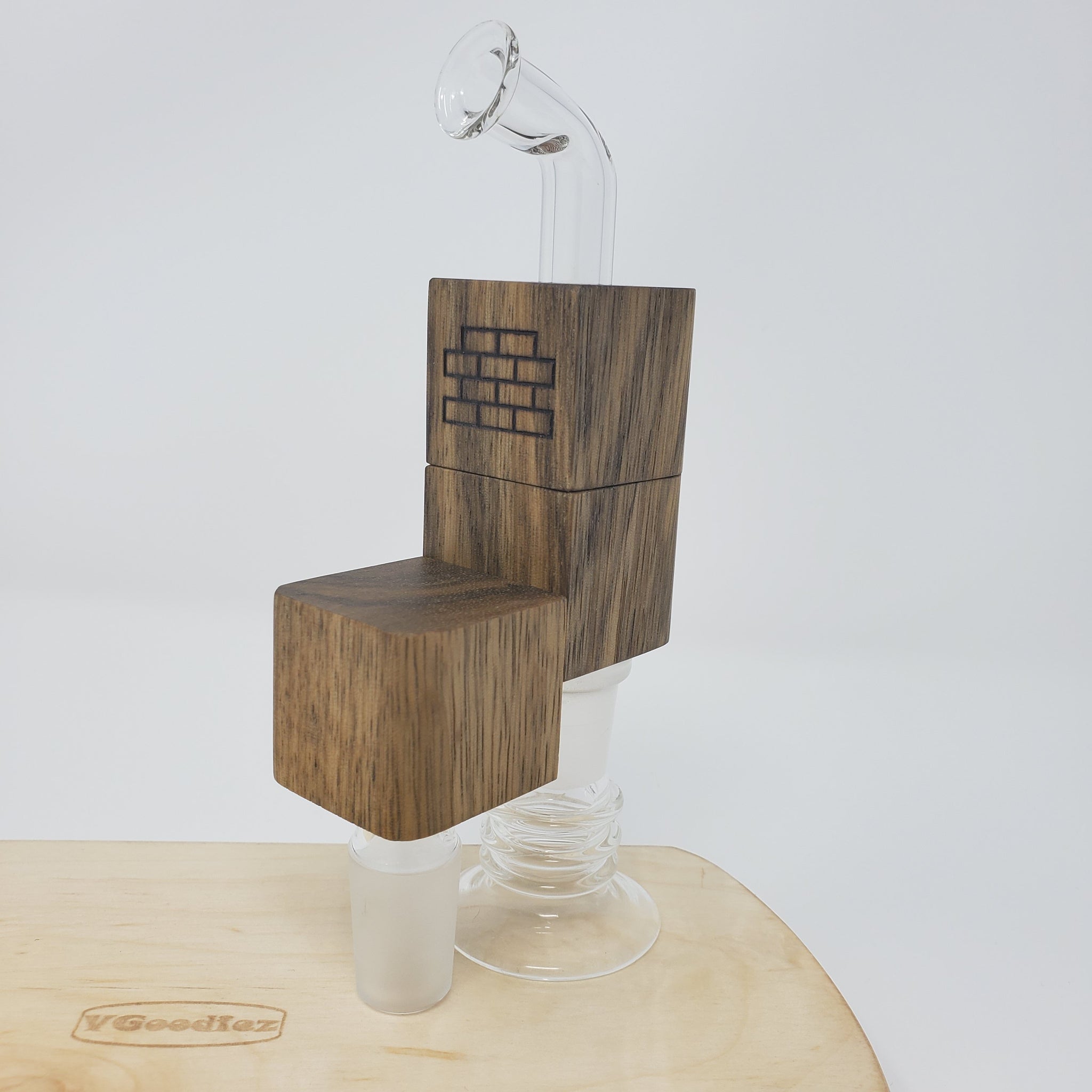 The smallest and lowest-priced device has been redesigned based on customer feedback. The Flip Brick is available in Walnut, Cherry, Rock Maple, and Black Limba, and is a direct WPA for all your water or J-hook needs. Designed to sit upright to store or load, the device flips to attach to your glass.